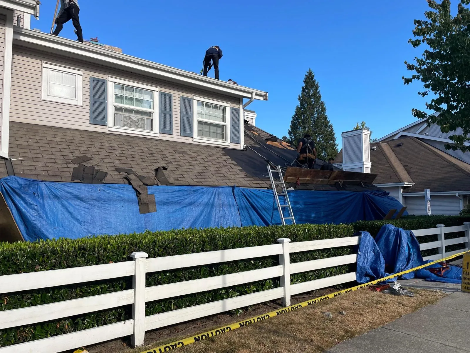 Professional roof inspection in Vancouver checking shingles, flashing, gutters, and roof condition