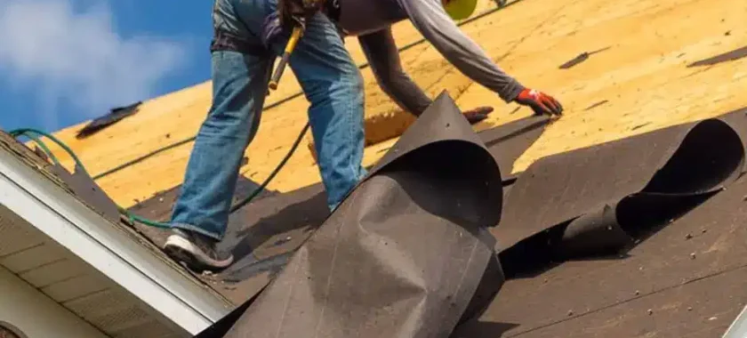Roof underlayment installed beneath shingles during a roofing project