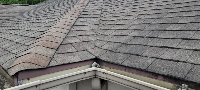 Roof drip edge damage with bent and corroded metal along the roof edge